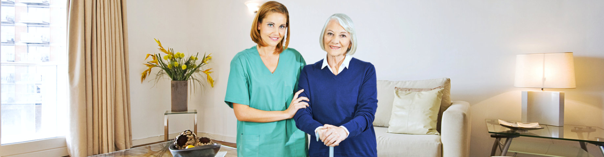 Caregiver and Senior woman smiling